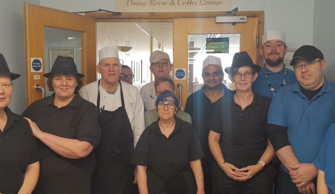 Group of staff members from the catering team at Lister hospital pose for a photo