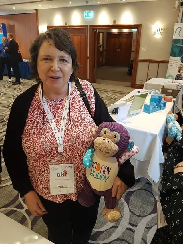 Marcia pictured with a kidney buddy monkey teddy at a kidney disease event.