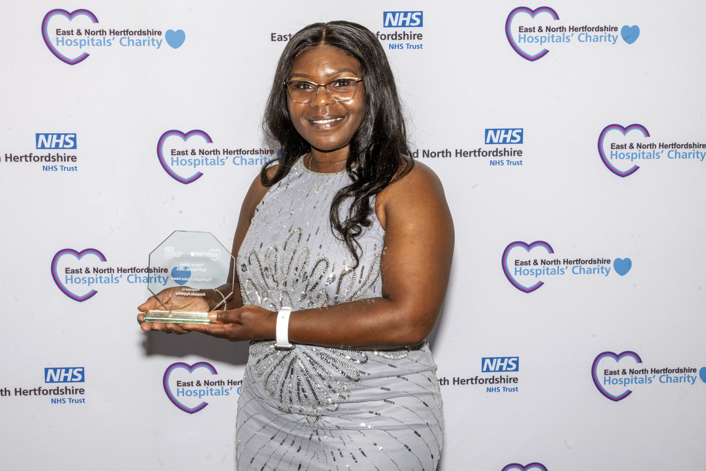 Irene Mafukidze collecting the People Award on behalf of Amanda Appleby.