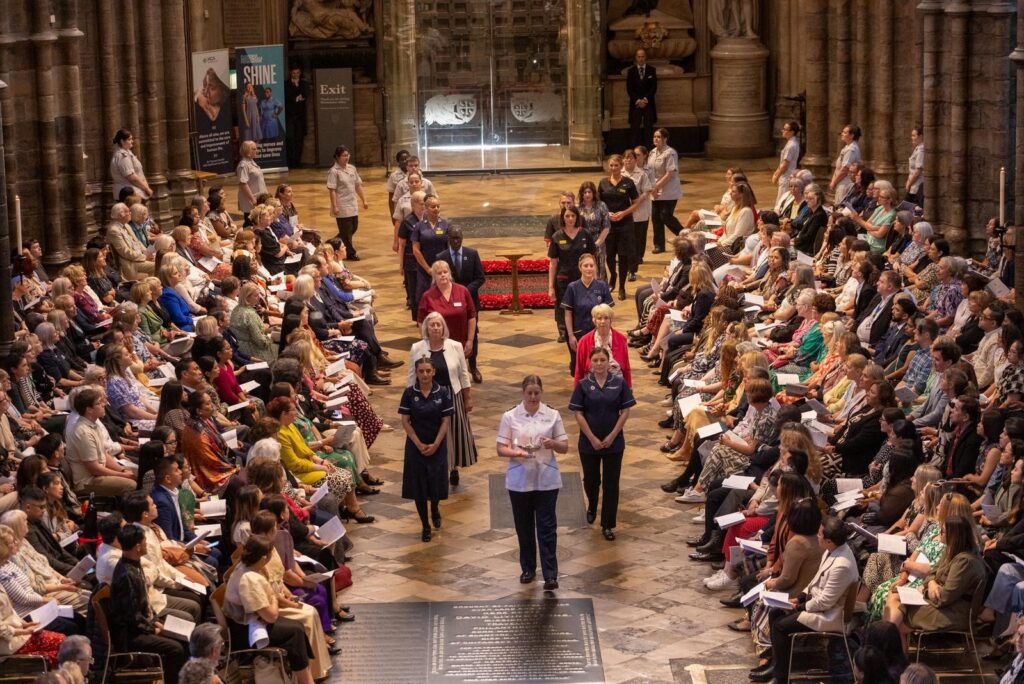 A photograph of Dionne Thompson leading the procession at the 2025 Florence Nightingale Service.