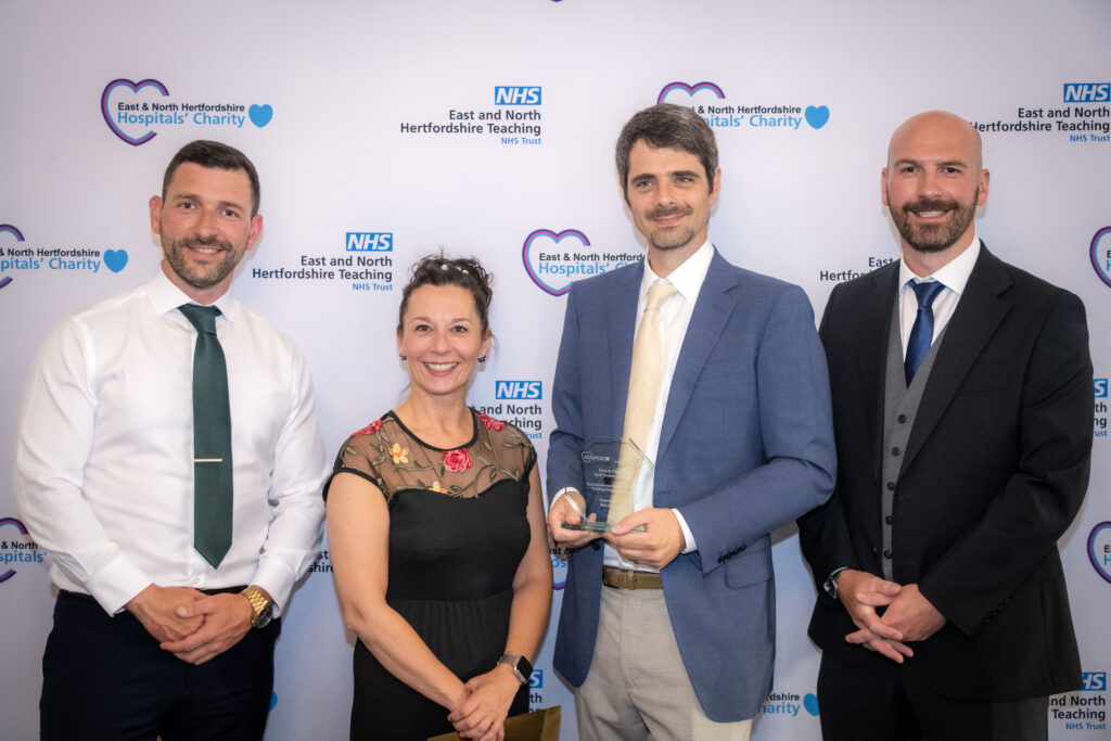 A photograph of award winner Ben Zalin, taken at the 2025 Time to Shine Staff Awards.