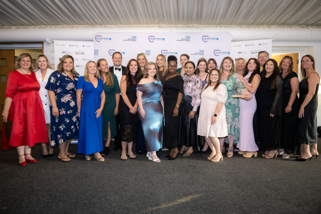 A photograph taken of award winners at the 2025 Time to Shine Awards.