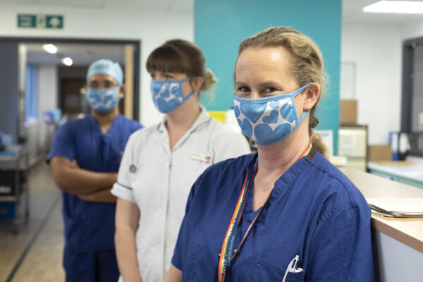 staff wearing charity masks