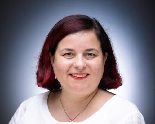 A professional portfolio headshot of COO Lucy Davies