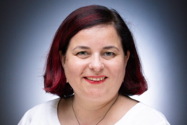 A professional portfolio headshot of COO Lucy Davies