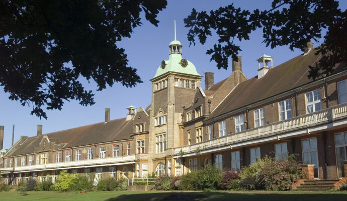 The Mount Vernon Cancer Centre building with the green lawn in the foreground of the picture.
