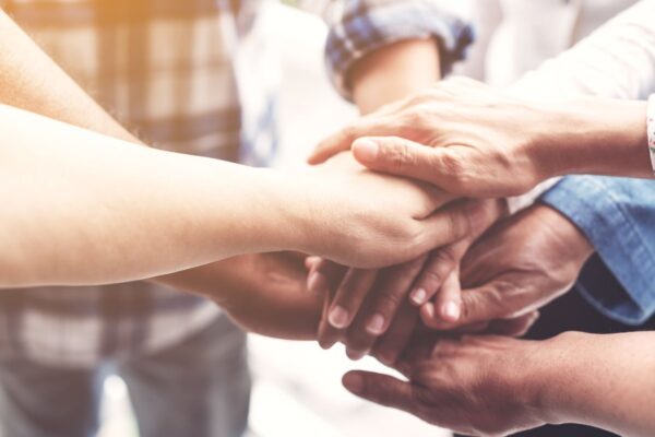 Group of people holding hands