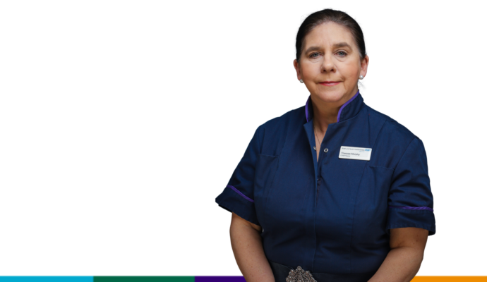 Chief nurse Theresa Murphy photographed on a white background. She is pictured wearing a nursing tunic.