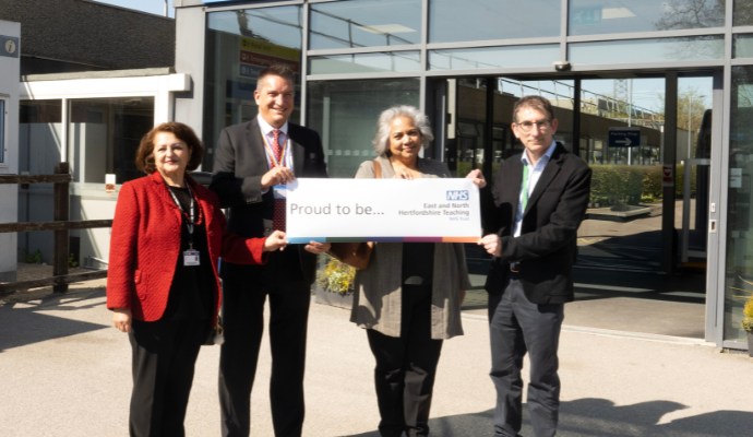 A photograph taken outside the main entrance to Lister Hospital. Photographed from left to right are: Zoe Aslanpour, Adam Sewell-Jones, Anita Day and Justin Daniels.