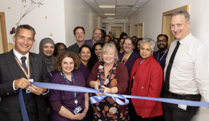 A photo of the audiology opening, with Dawn Bramham cutting the ribbon