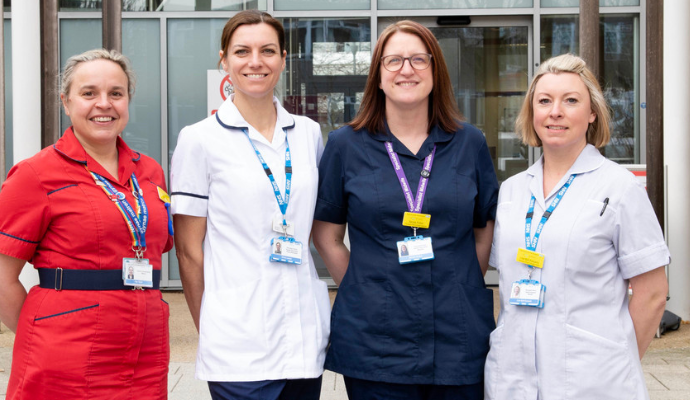 Members of the Perinatal Pelvic Health Service pose for a photograph outside Lister Hospital in Stevenage.