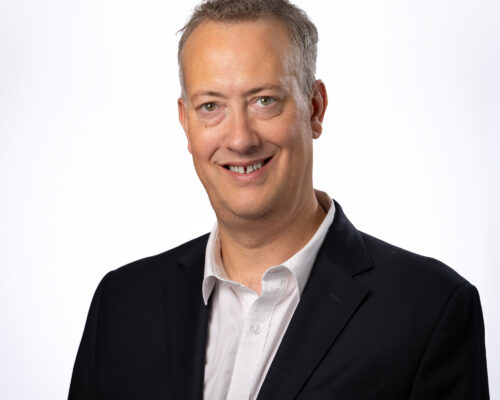 A professional headshot photo of Martin Armstrong, chief executive of East and North Hertfordshire Teaching NHS Trust.