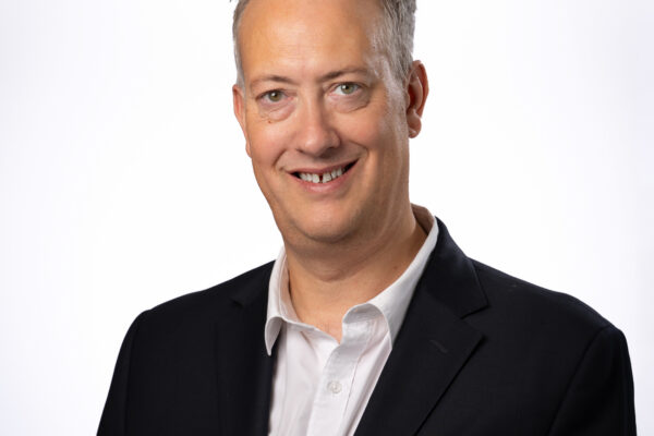 A professional headshot photo of Martin Armstrong, chief executive of East and North Hertfordshire Teaching NHS Trust.