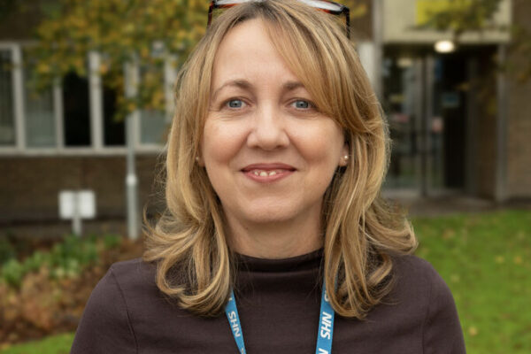A professional headshot image of Claire Moore, Interim Chief Operating Officer.